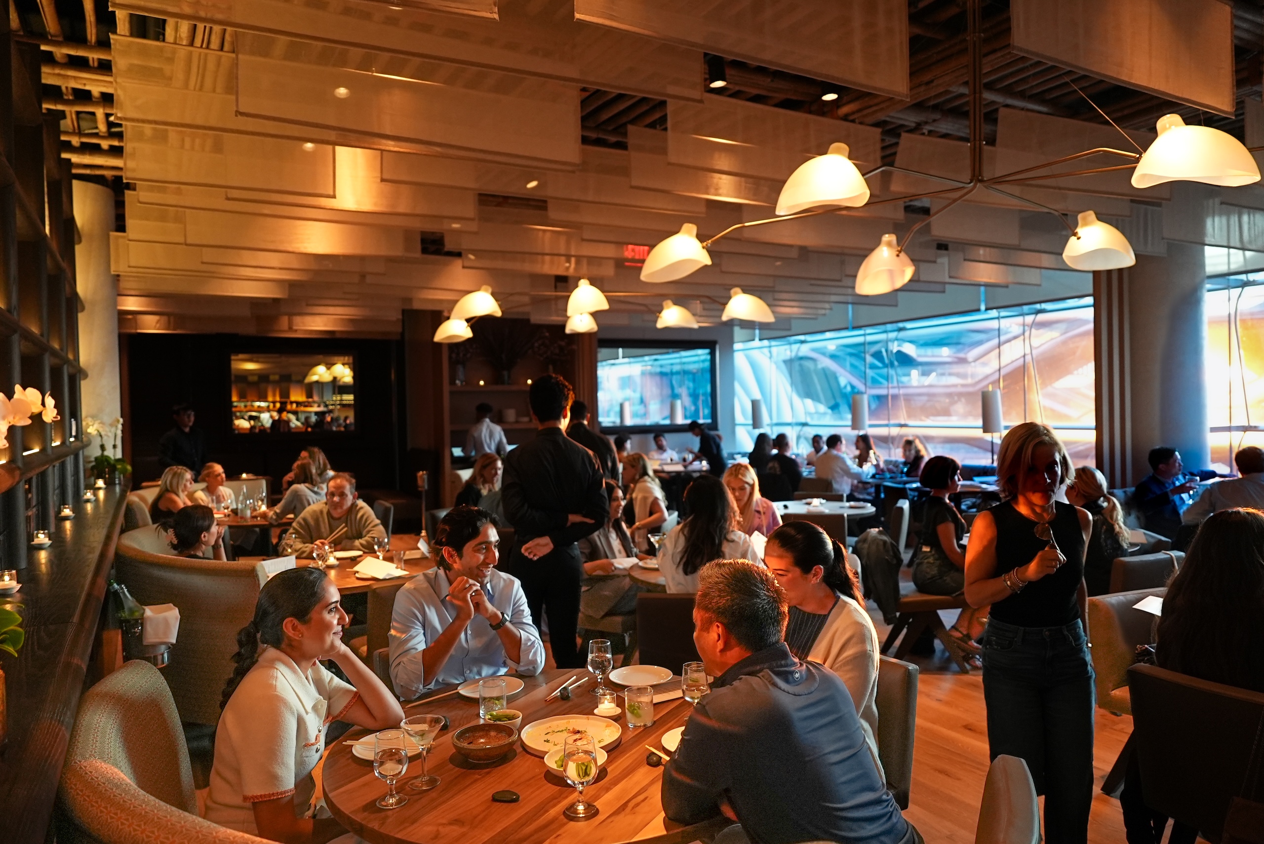 A full dining room overlooking Vessel