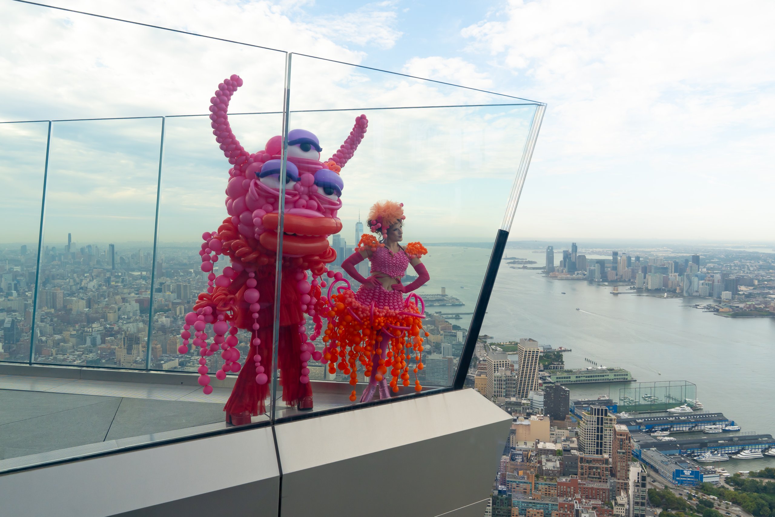 performers dressed for Garden of Shadows outside at the Edge NYC looking the NYC skyline